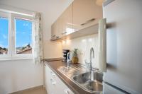 Kuchyň nebo kuchyňský kout v ubytování Apartments A&A