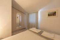 Łóżko lub łóżka w pokoju w obiekcie Apartments LIMIA