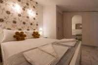 Łóżko lub łóżka w pokoju w obiekcie Apartments LIMIA