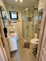 Kúpeľňa v ubytovaní Delfinek - Domki Apartamenty