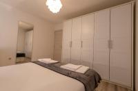 Łóżko lub łóżka w pokoju w obiekcie Apartments LIMIA
