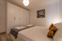 Łóżko lub łóżka w pokoju w obiekcie Apartments LIMIA