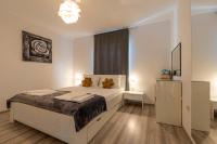 Łóżko lub łóżka w pokoju w obiekcie Apartments LIMIA