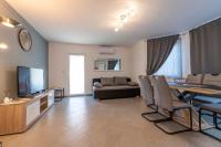 Telewizja i/lub zestaw kina domowego w obiekcie Apartments LIMIA
