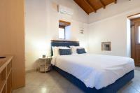 Posteľ alebo postele v izbe v ubytovaní Sophia Areopoli Guesthouse