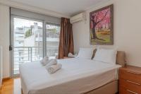 Posteľ alebo postele v izbe v ubytovaní Elvita Athens Sea View Maisonette
