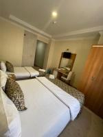 Postel nebo postele na pokoji v ubytování Dimet Park Hotel