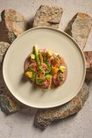 a plate of food on top of rocks at 1 Hotel Seattle in Seattle