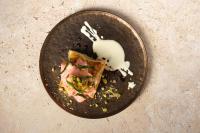 a plate with a piece of food with a fork on it at 1 Hotel Seattle in Seattle