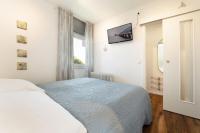 Postel nebo postele na pokoji v ubytování Seeschlösschen Wohnung 524
