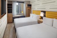 Ein Bett oder Betten in einem Zimmer der Unterkunft Hampton Inn by Hilton New York Times Square