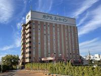 a building with a clock on the top of it at Hotel Route-Inn Aizuwakamatsu in Aizuwakamatsu
