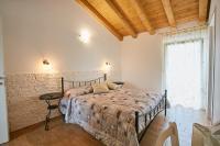 Cama o camas de una habitación en B&B Al sogno di Laura