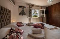 A bed or beds in a room at Eleni's Apartment Top Floor