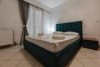 A bed or beds in a room at Eleni's Apartment Top Floor