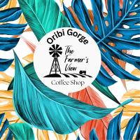 an illustration of a palm tree with the phrase the farmers view coffee shop at The Farmers Lodge in Thorndale