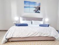 A bed or beds in a room at Eracles House near Ortigia Island