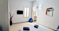 A television and/or entertainment centre at Eracles House near Ortigia Island