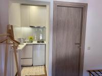 A kitchen or kitchenette at Pieros Studios Alipa