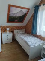 Posteľ alebo postele v izbe v ubytovaní Domki przy skwerku