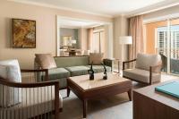 a living room with a couch and a table at The Ritz-Carlton, Sarasota in Sarasota