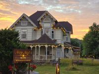 a house with a sign in front of it at Albergo Allegria Hotel &amp; Breakfast Restaurant in Windham