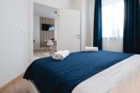 Posteľ alebo postele v izbe v ubytovaní Locus Apartments