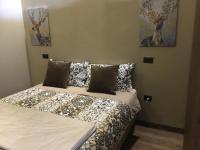 Łóżko lub łóżka w pokoju w obiekcie Corte degli Angeli Agriturismo