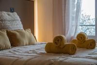 Łóżko lub łóżka w pokoju w obiekcie La babounette