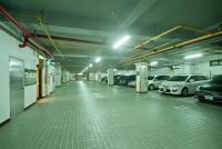 an empty parking garage with cars parked in it at F Hotel Tainan in Tainan
