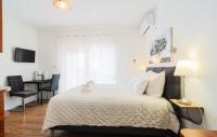 Posteľ alebo postele v izbe v ubytovaní Apartments Bubalo