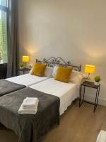 Posteľ alebo postele v izbe v ubytovaní 555 Apartments BCN