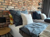 Posteľ alebo postele v izbe v ubytovaní Apartament nad Wilgą