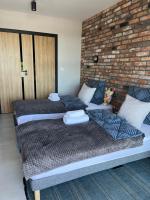 Posteľ alebo postele v izbe v ubytovaní Apartament nad Wilgą