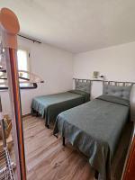 Postel nebo postele na pokoji v ubytování Villantoine De La Marina Di Orosei