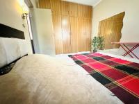 Postel nebo postele na pokoji v ubytování Desert Pearl Apartment