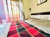 Postel nebo postele na pokoji v ubytování Desert Pearl Apartment