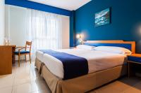 Postel nebo postele na pokoji v ubytování Hotel Villa De Pinto