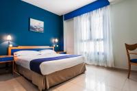 Postel nebo postele na pokoji v ubytování Hotel Villa De Pinto