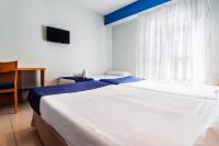 Postel nebo postele na pokoji v ubytování Hotel Villa De Pinto