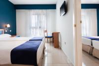 Postel nebo postele na pokoji v ubytování Hotel Villa De Pinto