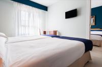 Postel nebo postele na pokoji v ubytování Hotel Villa De Pinto