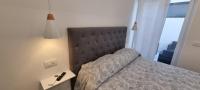 Posteľ alebo postele v izbe v ubytovaní Sorrento Punto It Apartment