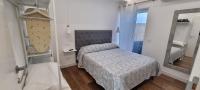 Posteľ alebo postele v izbe v ubytovaní Sorrento Punto It Apartment