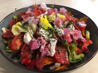 een bord met eten en groenten op tafel bij Aux Belles Vacances - ADULTS ONLY in Caux-et-Sauzens