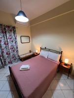 Postel nebo postele na pokoji v ubytování Village Apartment