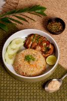een bord met eten met vlees en rijst en een lepel bij Little Stay Bophut - Samui in Ko Samui