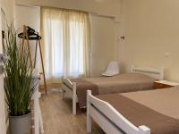 A bed or beds in a room at Kontos Mansion