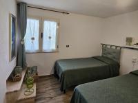 Postel nebo postele na pokoji v ubytování Villantoine De La Marina Di Orosei