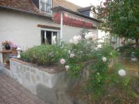 a house with flowers in front of it at Les rouches in Cormeray